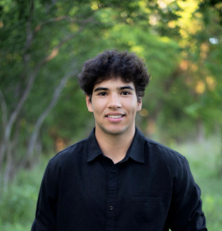 Gage Terrazas, founder of TRZ Shine & Detail, detailing a car in Austin, TX
